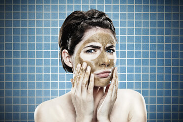 Portrait of young woman with medicinal clay mask, close up - SPO000457