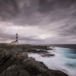 Spain, Menorca, Favaritx, View of lighthouse at sunset - SMA000147