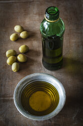 Olives and olive oil on table, close up - EVG000139