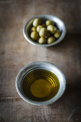 Olives and olive oil on table, close up - EVG000141