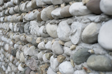 Italy, Construction of house building with pebble stone - CRF002432