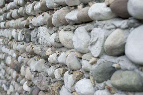 Italy, Construction of house building with pebble stone - CRF002432