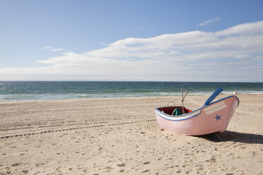 Portugal, Lisbon, View of small fishing boat at beach - SKF001313