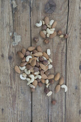 Mixed nuts on wooden board, close up - ASF005009