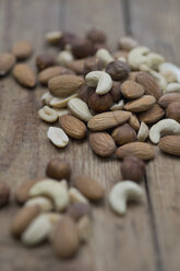 Mixed nuts on wooden board, close up - ASF005008