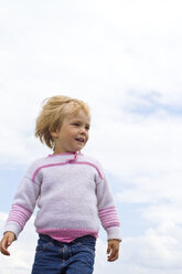 Germany, Kiel, Girl in front of sky, smiling - JFEF000147