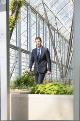 Germany, Hannover, Businessman walking - KFF000198