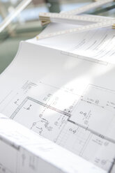 Architectural plan and folding rule on table - KFF000068