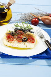 Feta, tomatoes, olives and rosemary in plate with fork - MAEF007020