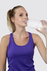 Young woman drinking water, close up - GDF000123