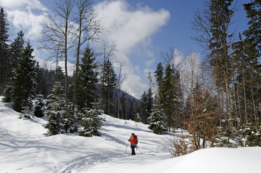 Germany, Mature woman hiking during winter - LB000208