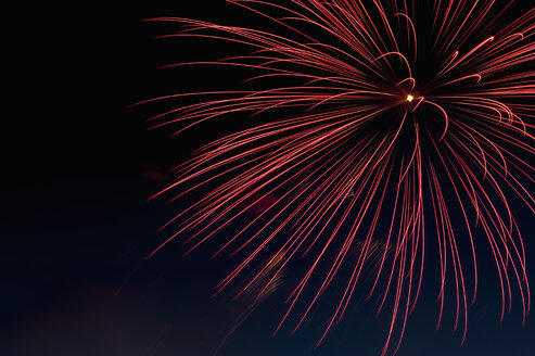 Germany, North Rhine Westphalia, Duesseldorf, Fireworks exploding in sky - KJF000248