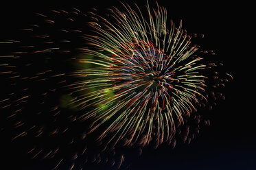 Germany, North Rhine Westphalia, Duesseldorf, Fireworks exploding in sky - KJF000242
