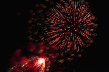 Germany, North Rhine Westphalia, Duesseldorf, Fireworks exploding in sky - KJF000237