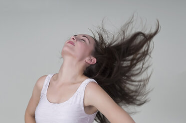 Young woman blowing hair - BFRF000237