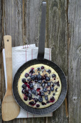 Blueberry pancake in pan with wooden spoon - OD000299