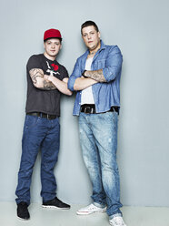 Portrait of young men with tattoos - STKF000329