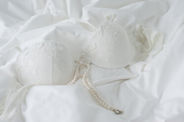 White Lace Bra On Edge Bed Stock Photo 722967511