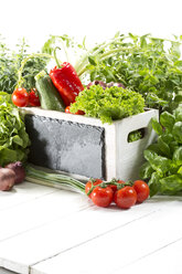 Variety of fresh vegetables in wooden box, close up - MAEF007174