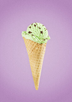 Ice Cream in cone against purple background, close up - CHF000061