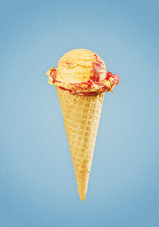 Ice Cream in cone against blue background, close up - CHF000060