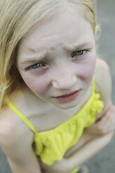 Germany, North Rhine Westphalia, Cologne, Portrait of girl standing on street, close up - JATF000251