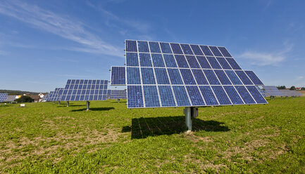 Germany, Bavaria, Solar panels on grass - AM000871