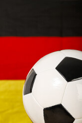 Soccer ball infront of German Flag, close up - KRPF000022