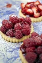 Germany, Raspberry cakes on table, close up - TK000141