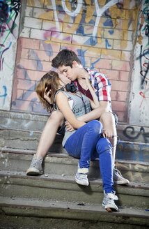 Germany, Berlin, Teenage couple kissing each other - MVC000002