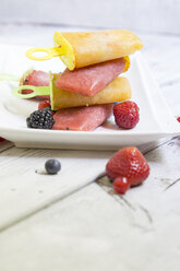 Homemeade flavoured ice with berries on wooden table, close up - STB000015