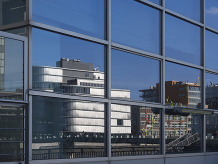 Germany, North Rhine Westphalia, Duesseldorf, Reflection of media harbour buildings - HHEF000055