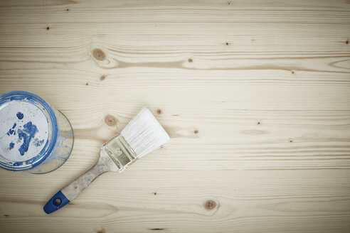 Paint tin and paintbrush on wood, close up - DSCF000105