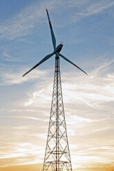 Germany, Lower Saxony, Gesold, wind wheel during sunset - MSF003010