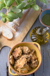 Baked zucchini slices with egg crust in yellow bowl - ODF000387