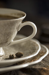 Cup of coffee and saucer with coffee beans - MYF000017