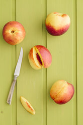 Peaches and fruit knife, elevated view - ECF000327