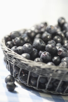 Blueberries on garden table - ASF005157