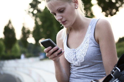 Young woman with smart phone stock photo