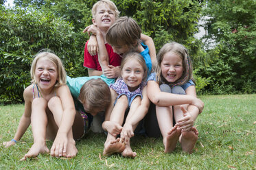 Exuberant children in garden - NHF001437