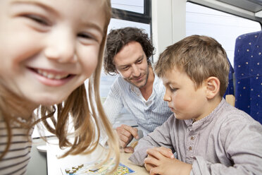 Happy family playing in a train - KFF000277