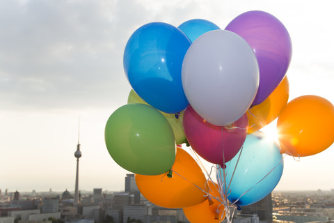 Germany, Berlin, View over city from rooftop terrace with balloons stock photo
