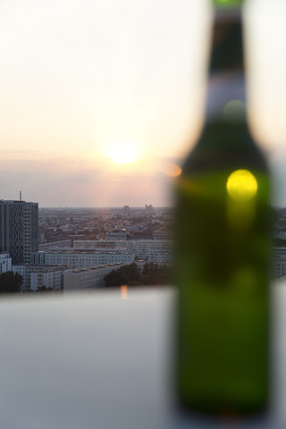 Germany, Berlin, Bottle of beer on balustrade stock photo