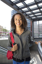 Germany, Berlin, Young women in the city, using escalator - FKF000248