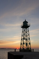 Germany, Bremen, Bremerhaven lighthouse at sunset - SJF000061