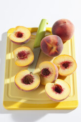 Peaches on cutting board - CSF020015