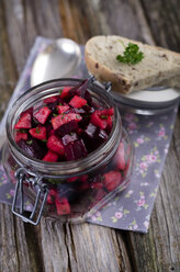 Beetroot salad in a preserving jar with olive bread - ODF000524