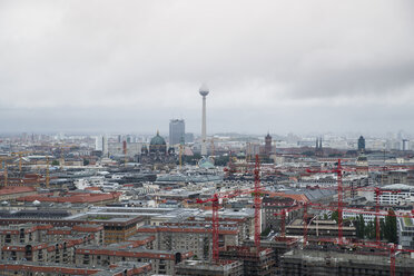 Germany, Berlin, view to television tower, construction cranes in front - MYF000028
