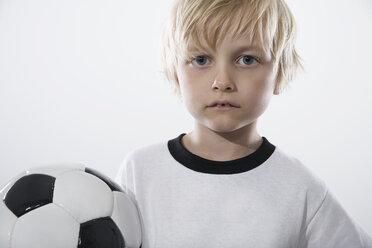 Boy in soccer jersey holding ball - PDF000469