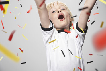 Boy in soccer jersey cheering - PDF000472